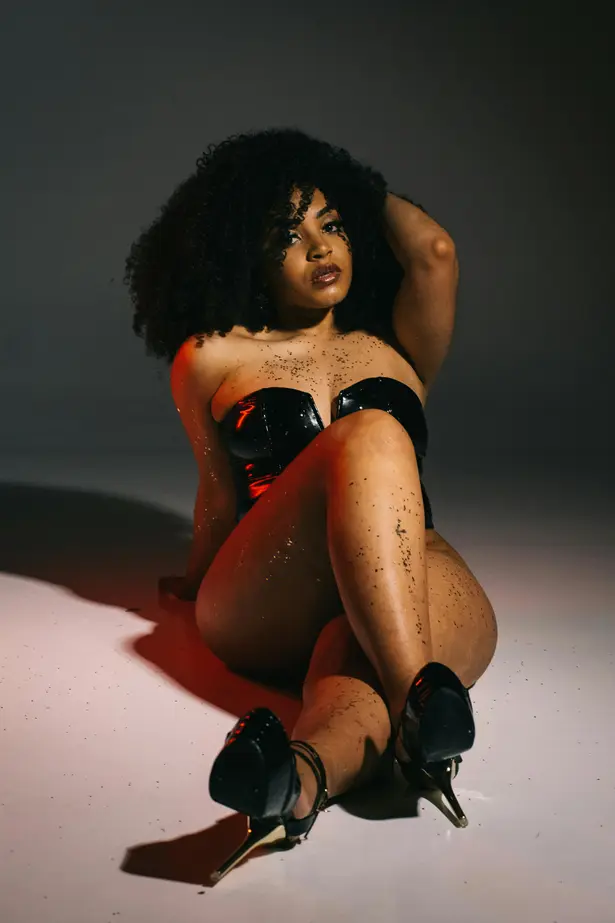 black women lying with High heels 